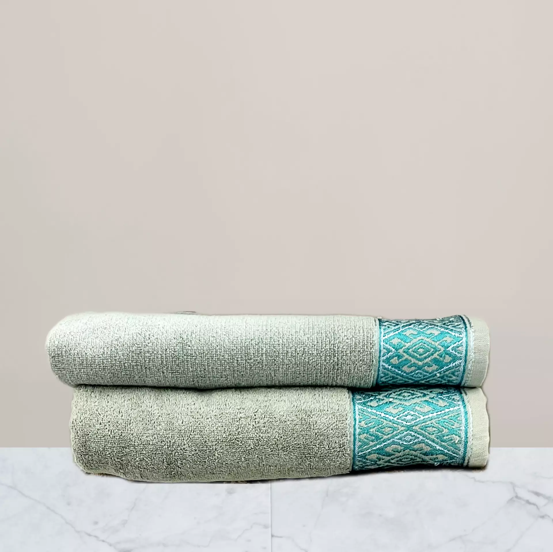 a stack of towels on a marble surface green towel 600 gsm towel